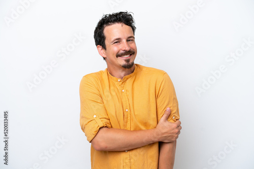 Young man with moustache isolated on white background laughing