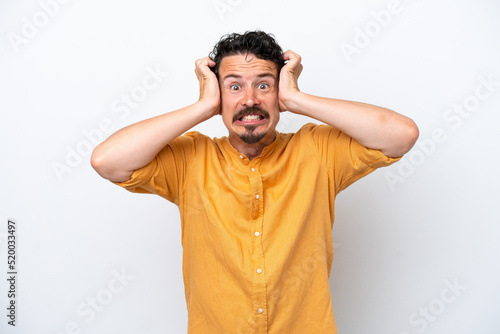 Young man with moustache isolated on white background doing nervous gesture