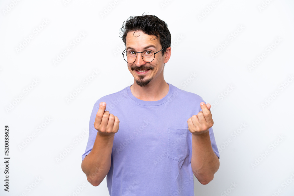 Young man with moustache isolated on white background making money gesture Young man with moustache isolated on white background making money gesture