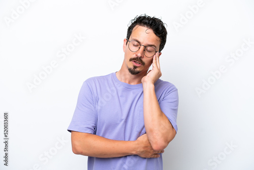 Young man with moustache isolated on white background with headache