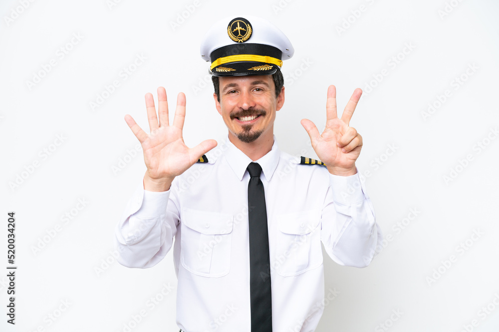 Airplane caucasian pilot isolated on white background counting eight with fingers Airplane caucasian pilot isolated on white background counting eight with fingers
