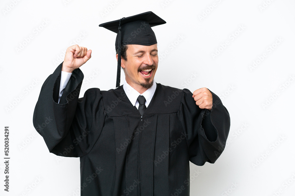 Young university graduate man isolated on white background celebrating a victory Young university graduate man isolated on white background celebrating a victory
