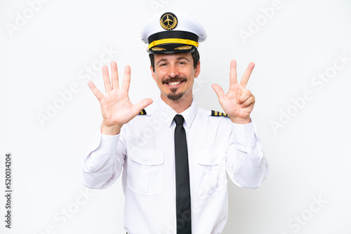 Airplane caucasian pilot isolated on white background counting eight with fingers © luismolinero