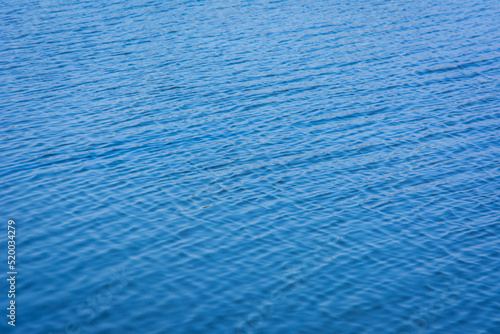 Blue tones water waves surface as background