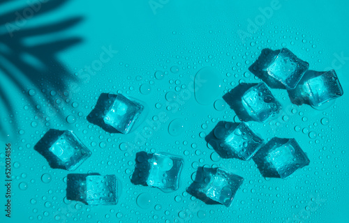 Fototapeta Naklejka Na Ścianę i Meble -  Ice cubes on a blue background. Selective focus.