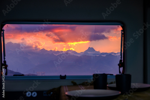 Tramonto dalla finestra del camper sul Passo della Novena, Svizzera photo