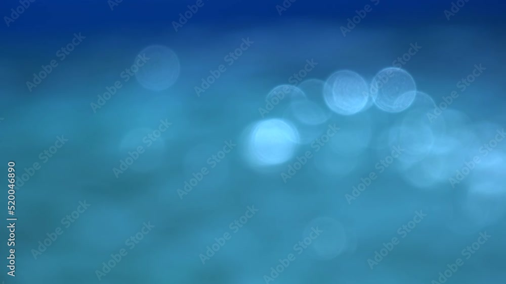 Defocused blue pool water surface glittering bokeh as abstract background Defocused blue pool water surface glittering bokeh as abstract background