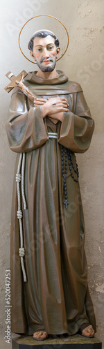 MATERA, ITALY - MARCH 7, 2022: The carved polychrome statue of St. Francis of Assisi in the church Chiesa di San Francesco Assisi by Francesco Pentasuglia (1986).