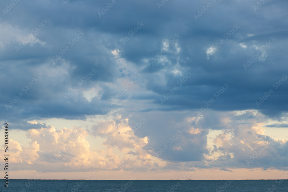 cloudy sky on the sea in sunlight,clouds background at sunset