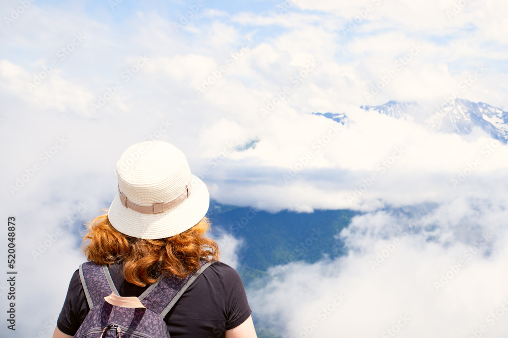 Travel, adventure and discovery by Hiking, woman with a backpack on top of a mountain Travel, adventure and discovery by Hiking, woman with a backpack on top of a mountain