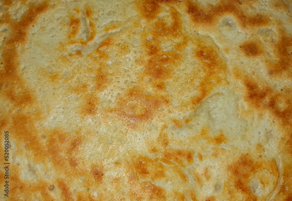 a close-up with the texture of a fried pancake a close-up with the texture of a fried pancake