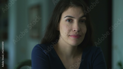 Portrait of a smiling 30s female looking at camera. Happy positive woman at home © Marco