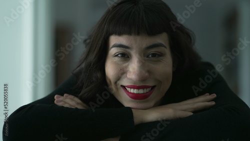 Portrait of a happy hispanic latin woman. Closeup of a South American Brazilian girl smiling at camera