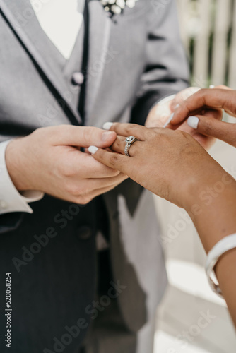wedding rings and groom
