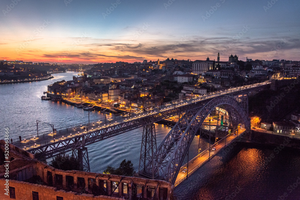 Porto, Portugal cityscape over the Douro River and Dom Louis Bridge.