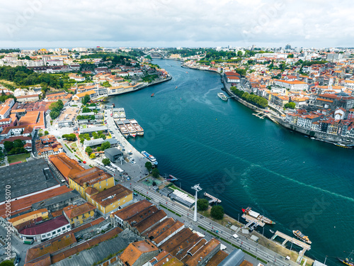 Porto Portugal Aerial View. Dom Luis Bridge at Sunrise. Porto, Portugal. Cityscape of Downtown Touristic Ribeira. Olt Town. Douro River.