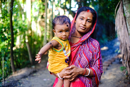 south asian young mother with her son, Bangladeshi hindu religious woman wearing traditional clothes, mom with child 