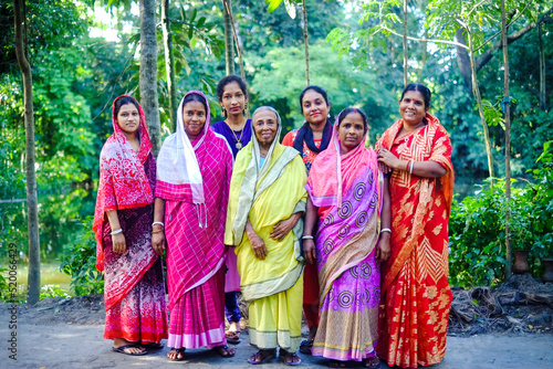 Photo of a south asian combined family,Female members of a Bangladeshi hindu religious family wearing colourful traditional dresses