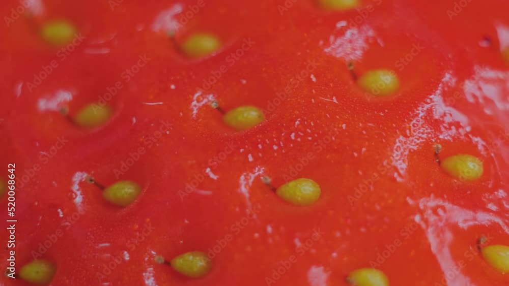 Close up: fresh juicy red strawberry on rotating surface - macro. Organic, summer and healthy food concept Close up: fresh juicy red strawberry on rotating surface - macro. Organic, summer and healthy food concept