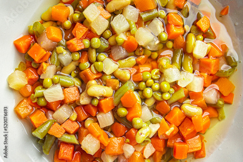 mix vegetables cut cubes beans, peas, green beans, carrots, celery Macedonian vegetables bunch of juicy vegetables fresh dish healthy meal food snack diet on the table copy space food background 
