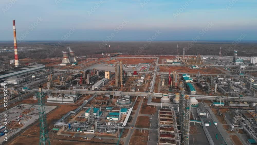 Aerial view of a large industrial complex for deep processing of oil and gas in polymers. Drone view of chillers, pipelines and industrial buildings. Drone view of industrial. Aerial view of a large industrial complex for deep processing of oil and gas in polymers. Drone view of chillers, pipelines and industrial buildings. Drone view of industrial.