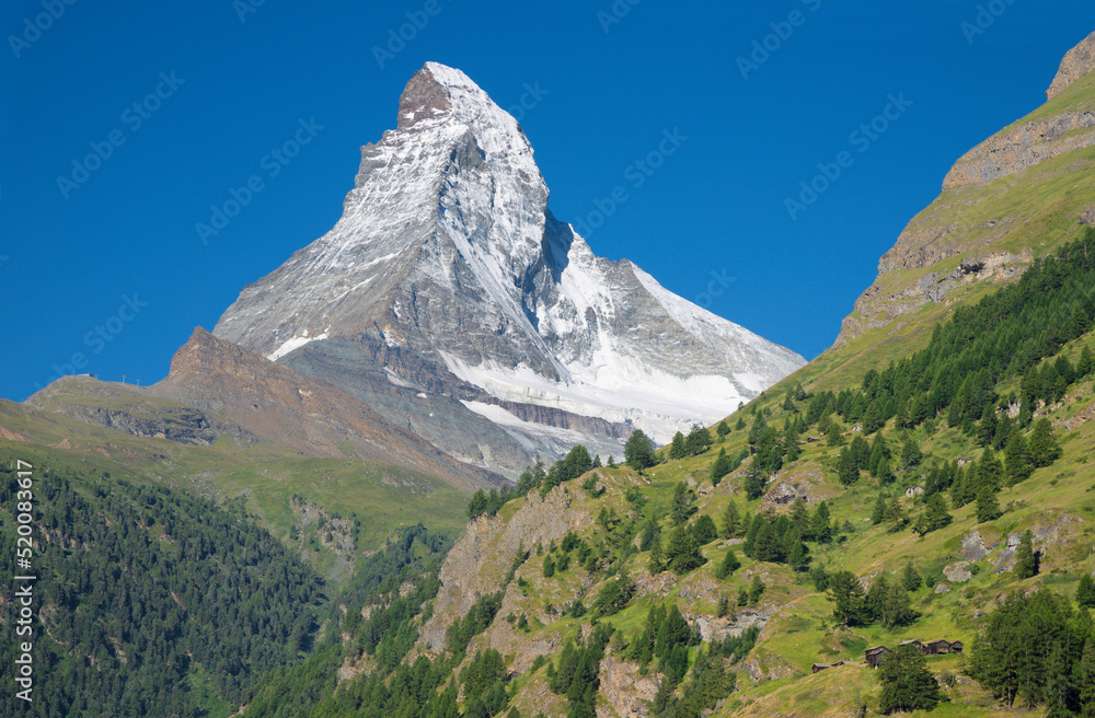 The Matterhorn peak over Mattertal valley in Valliser alps.