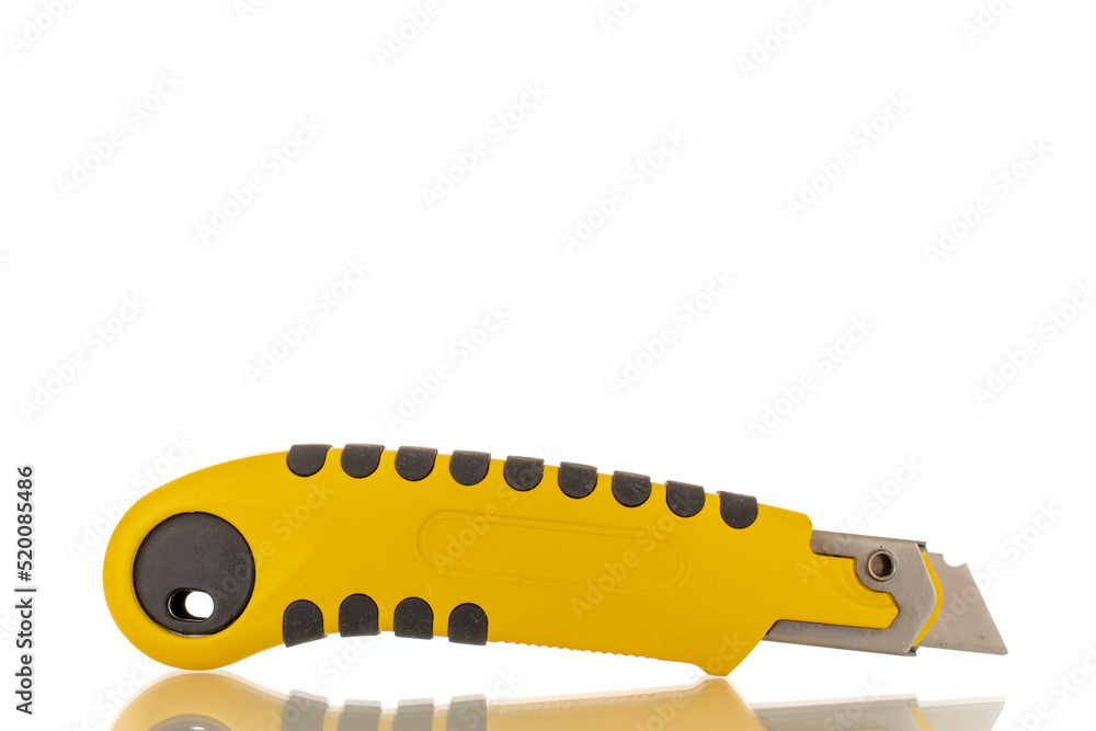 One construction knife, close-up, isolated on a white background. One construction knife, close-up, isolated on a white background.