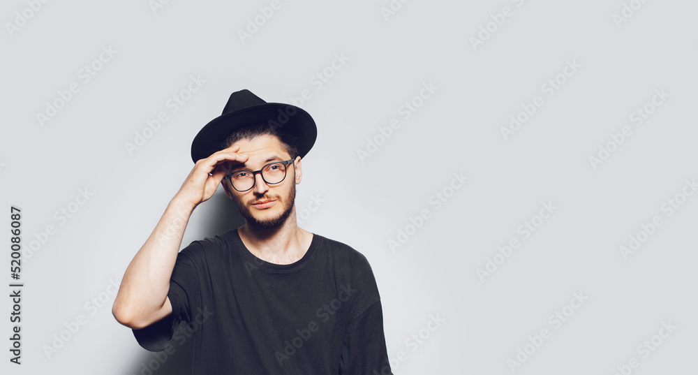 Panoramic banner portrait of young thoughtful man on white background with copy space. Panoramic banner portrait of young thoughtful man on white background with copy space.