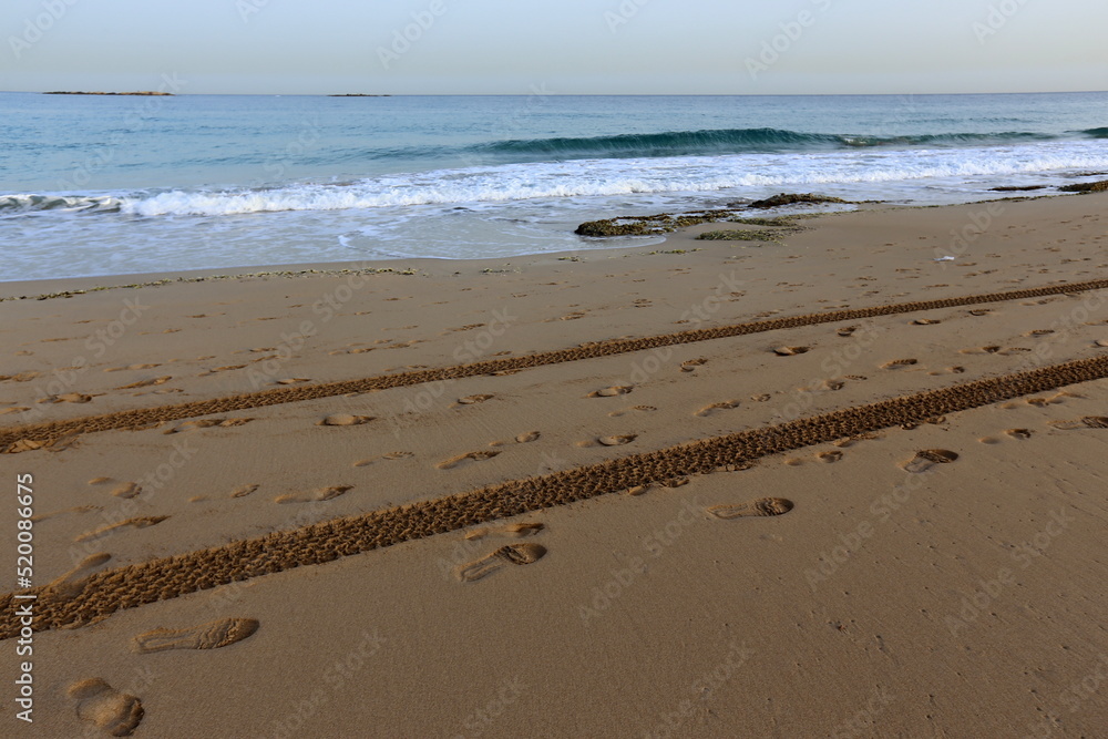 Footprints in the sand on the city beach. Footprints in the sand on the city beach.