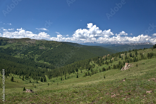 Scenic view of a mountain pass from above in the early summer months