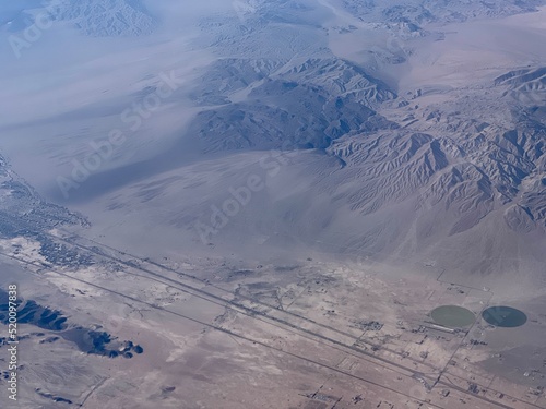 Aerial view of mountains, desert landscape, and roads in Newberry Springs area of California