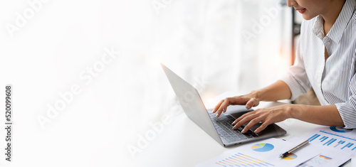 Crop shot of woman hand works on laptop Bookkeeper or financial inspector hands with copy space making the report and calculating. Home finances, investment, economy, or insurance concept