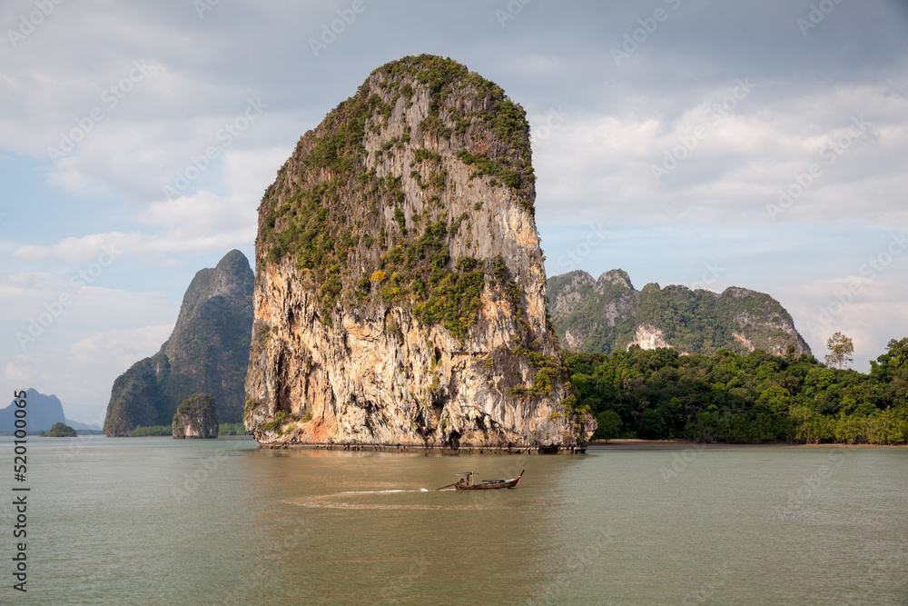 Boat in front of a Thailand island mountain. Boat in front of a Thailand island mountain.