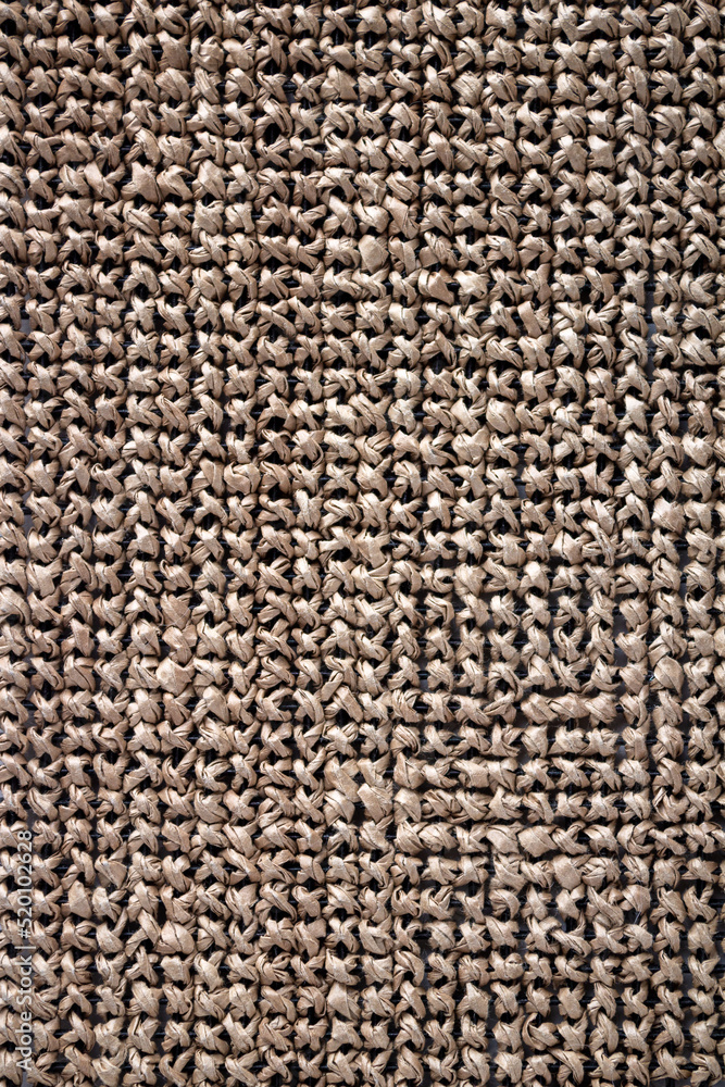 the textured canvas is embroidered with a cross made of raffia paper yarn the textured canvas is embroidered with a cross made of raffia paper yarn