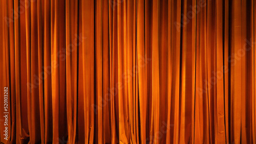 The yellow curtain. Theatrical scenes with light from the spotlights in the closed position