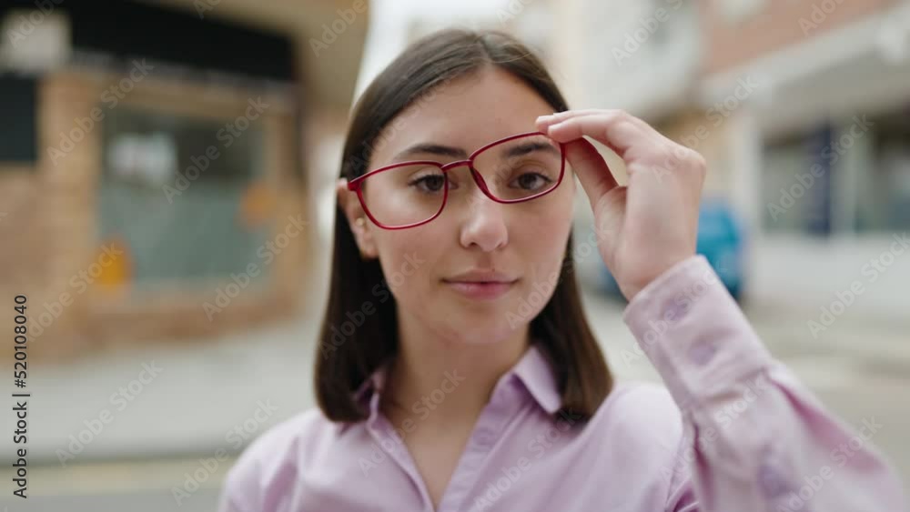 Young hispanic woman smiling confident wearing glasses at street Young hispanic woman smiling confident wearing glasses at street