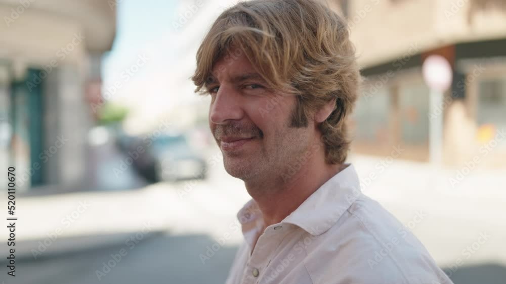 Young man smiling confident standing at street Young man smiling confident standing at street