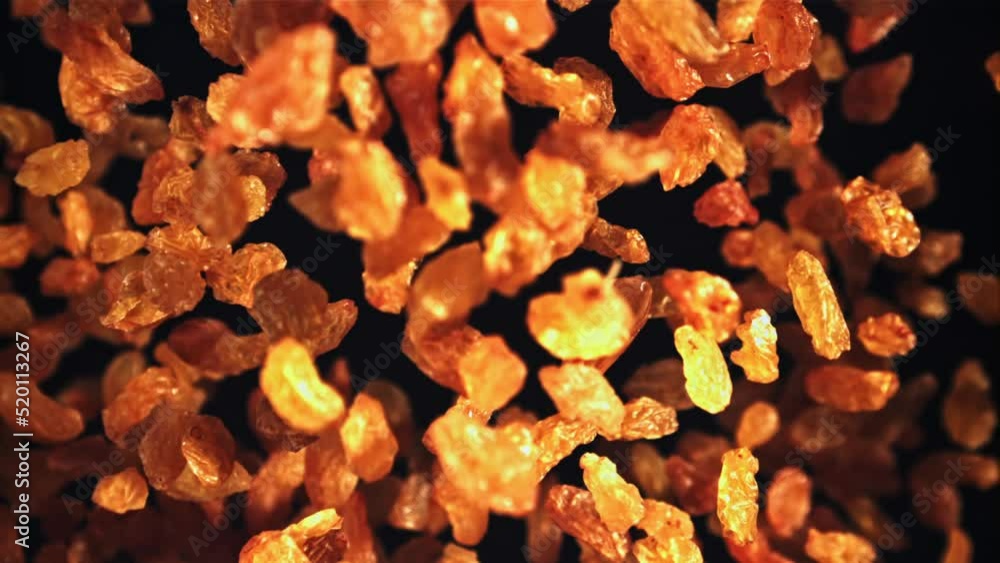 Raisins go up and fall down. On a black background. Top view. Filmed on a high-speed camera at 1000 fps. Raisins go up and fall down. On a black background. Top view. Filmed on a high-speed camera at 1000 fps.