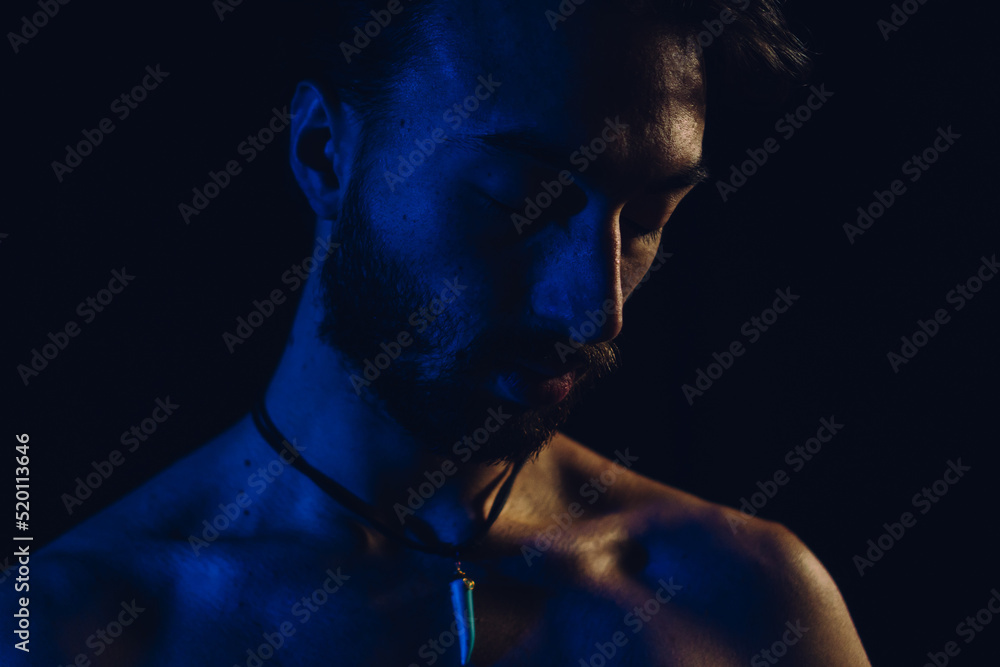 portrait of a young latin man with sad down look, close up portrait of a young latin man with sad down look, close up