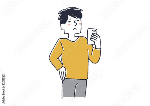 スマホを見ながら考え事をしている男性　
