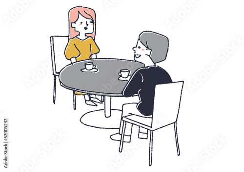 テーブルに座り会話をするカップル　喫茶店やカフェでの風景