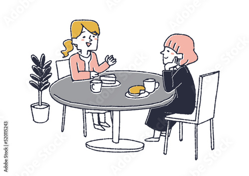 テーブルに座り楽しくおしゃべりをする二人の女性　喫茶店やカフェでの風景
