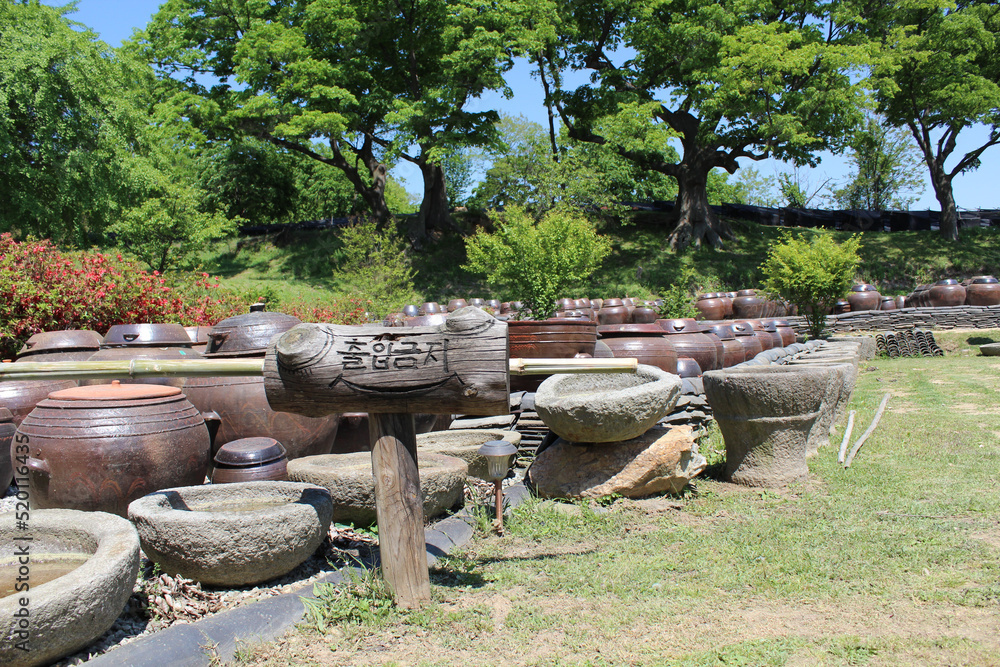 Jangdokdae in the yard of a traditional Korean house. Korean jar Jangdokdae in the yard of a traditional Korean house. Korean jar