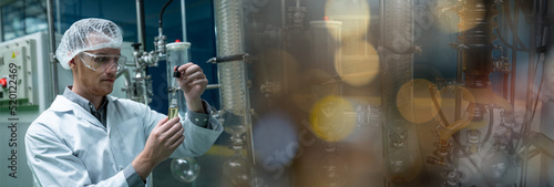 Картината върху платно Professional Scientist holding Cannabis oil bulbs and checking vaporizer during CBD oil extraction in science lab, Banner cover design
