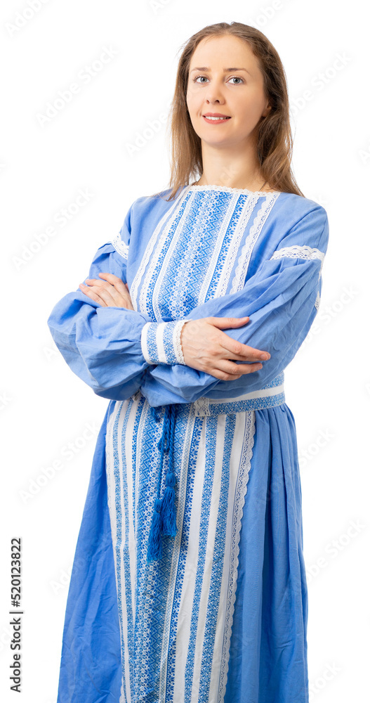 A woman in a Russian folk costume put her hands on her chest, a Russian woman coquettishly, playfully smiles at us. portrait of a beautiful, cute girl. Russian beauty. country girl. isolated