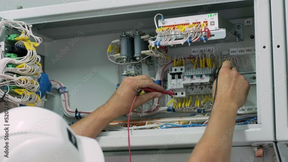 Electrical engineer working check the electric current voltage and ...