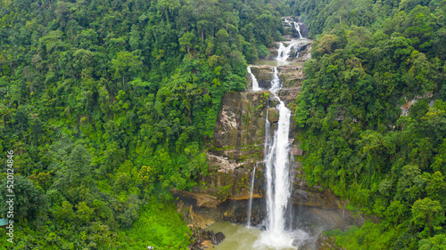 Tropical Aberdeen Falls in mountain jungle, Sri Lanka. Waterfall in the tropical forest.