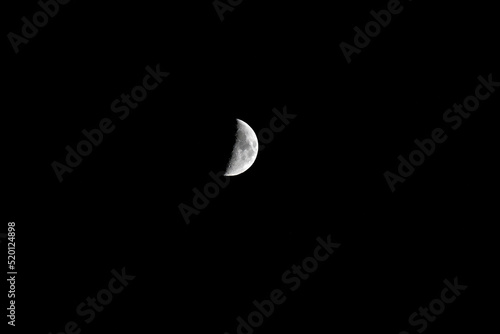 Quadro su tela Waxing Crescent moon against black sky