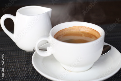 Close up of cup of coffee with milk