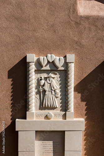 Base Relief at The Santo Nino Chapel at Sanctuario de Chimayo, Chimayo, New Mexico, USA photo